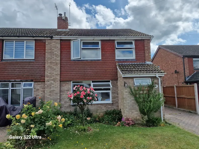 Semi-detached house in Aldham before work began, with red hanging tiles on the upper floor